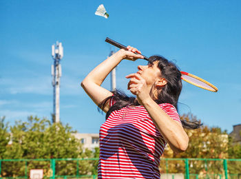 Woman playing badminton at park