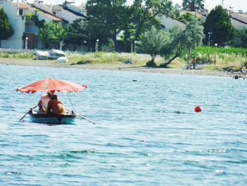 Man and woman floating on water