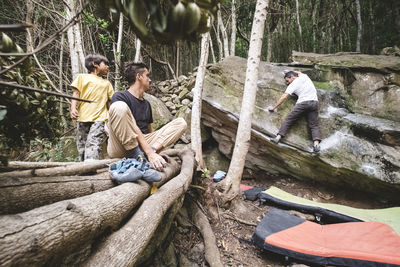 Pulled back view of bouldering spot in a forest