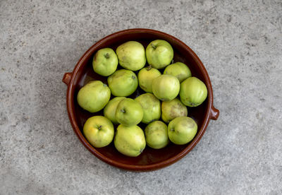 High angle view of fruits in bowl on floor