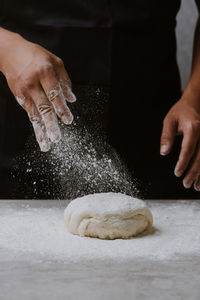 Close-up of man preparing food