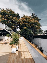 High angle view of trees by building against sky