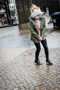 Woman walking on sidewalk