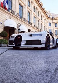 Cars on street by buildings in city