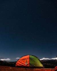 Low angle view of tent against sky at night