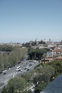 High angle view of city buildings against clear sky