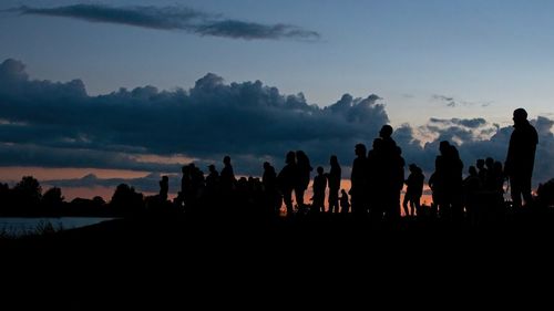 Group of people at sunset