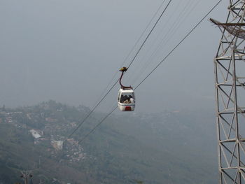 Overhead cable car against sky