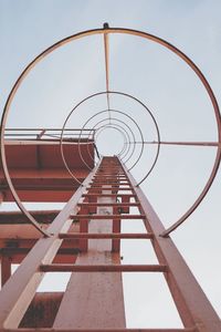 Low angle view of metallic structure against sky