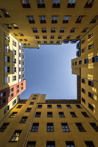 Low angle view of buildings against clear sky