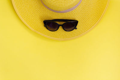 Close-up of sunglasses on hat