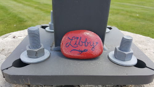 Close-up of telephone booth on grass