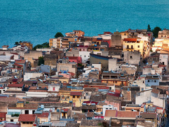 High angle view of townscape by sea