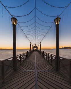 Pier over sea against sky