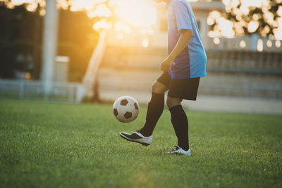 Man playing soccer on field