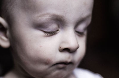 Close-up of boy with eyes closed