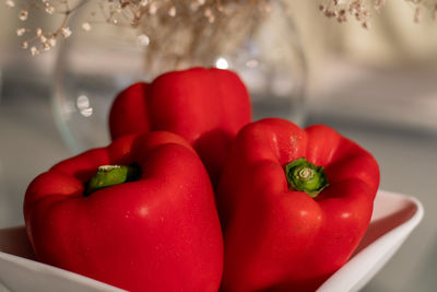 Close-up of red bell peppers on table