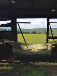 Scenic view of field against sky seen through window