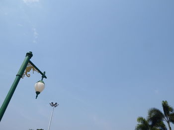 Low angle view of street light against sky