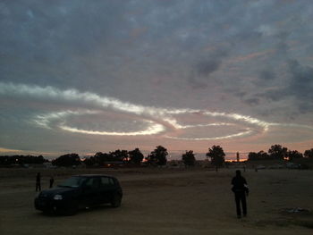 Scenic view of landscape against cloudy sky