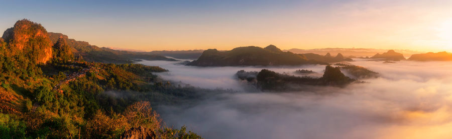 Panoramic view of mountains against sky during sunset