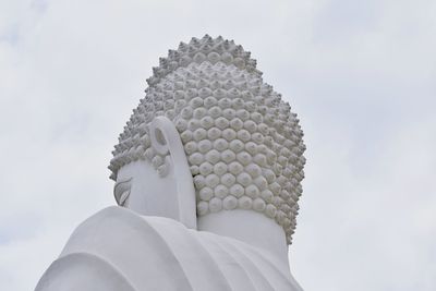 Low angle view of statue against sky