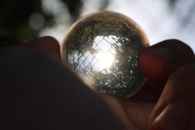 Close-up of hand holding crystal