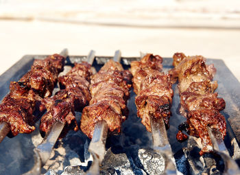Close-up of meat on barbecue