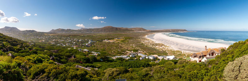 High angle view of sea and buildings against sky