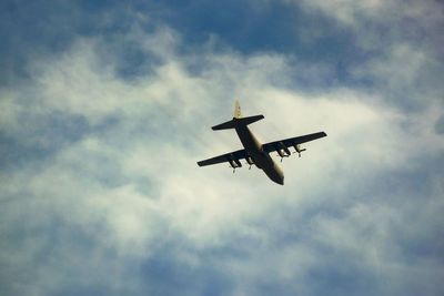 Low angle view of airplane flying in sky