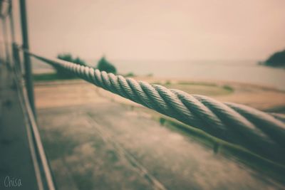 Close-up of rope against sea