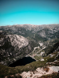 Scenic view of rocky mountains against clear blue sky