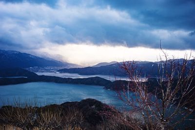 View of lake against cloudy sky