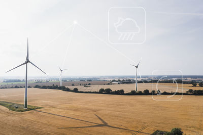 Wind turbines models in rural landscape