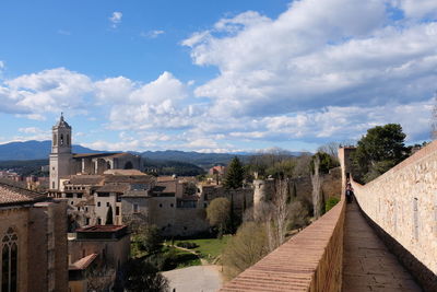 Panoramic view of buildings in city against sky