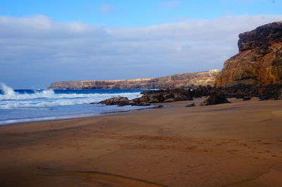 Scenic view of beach against sky