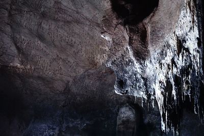 Low angle view of icicles on rock formation