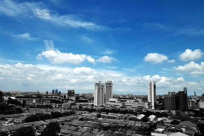 Directly above shot of cityscape against blue sky