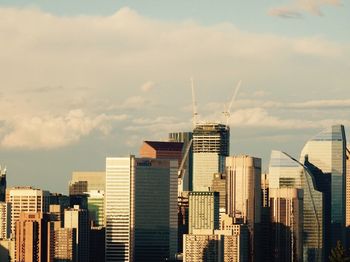 Skyscrapers in city against sky