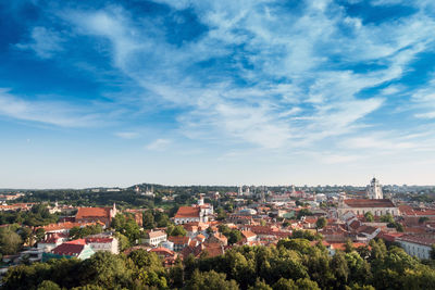 Houses in town against sky