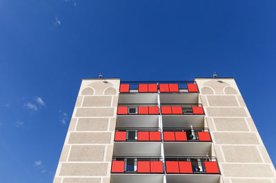 Low angle view of building against blue sky