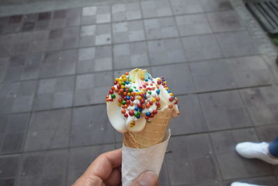 Hand holding ice cream cone