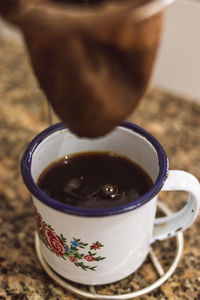 Close-up of coffee cup on table