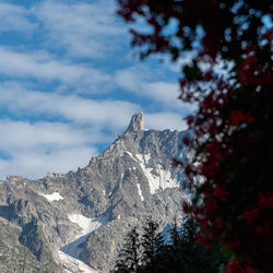 Low angle view of snowcapped mountain against sky