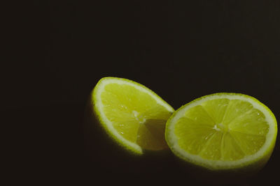 Close-up of lemon slice against black background
