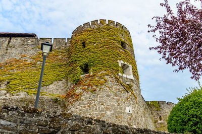 Low angle view of old building against sky