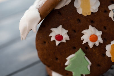 Cropped hand of woman holding christmas decoration
