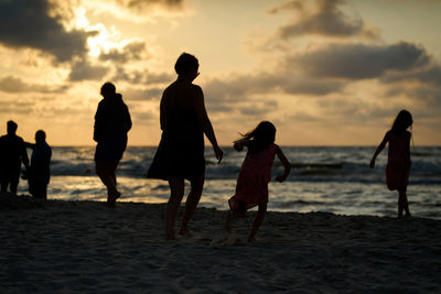 Family vacation sunset happy together at the beach