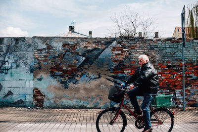 Man riding bicycle in city