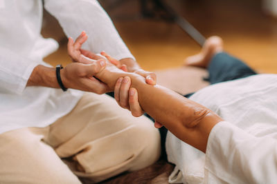 Shiatsu hand massage. therapist activating the heart meridian.